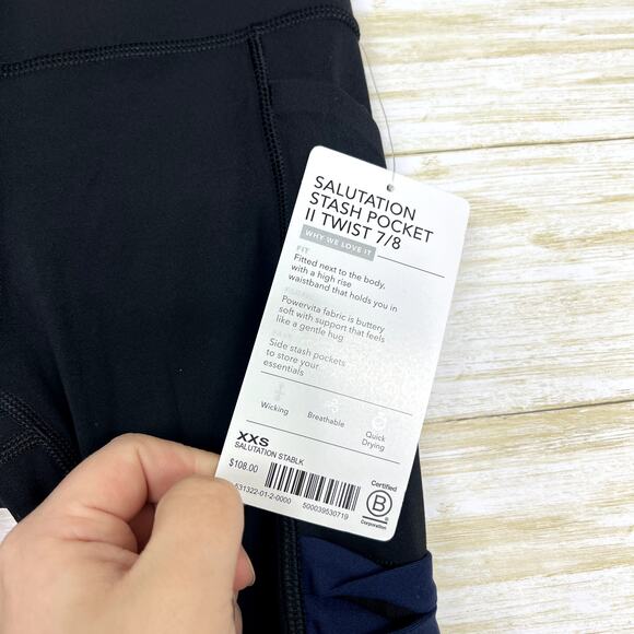 Athleta NWT Salutation Stash Pocket Twist II 7/8 Tight Black/Navy - Picture 6 of 8